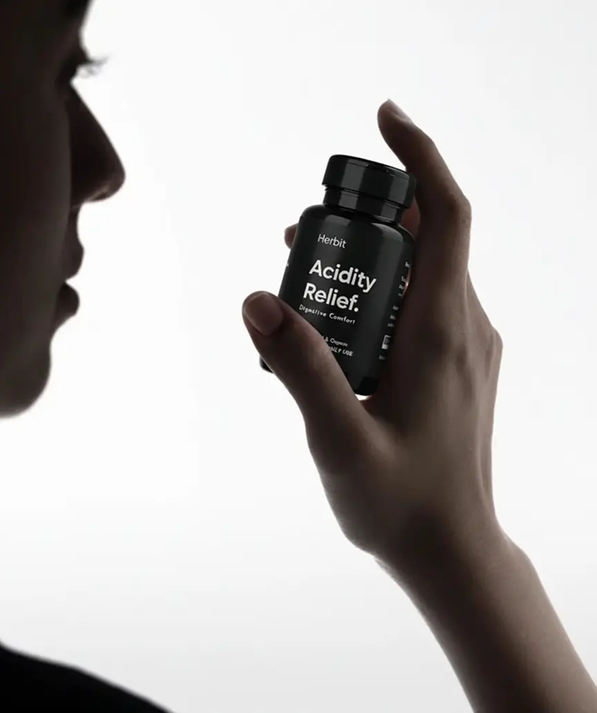 Herbit Acidity Relief bottle held in hand